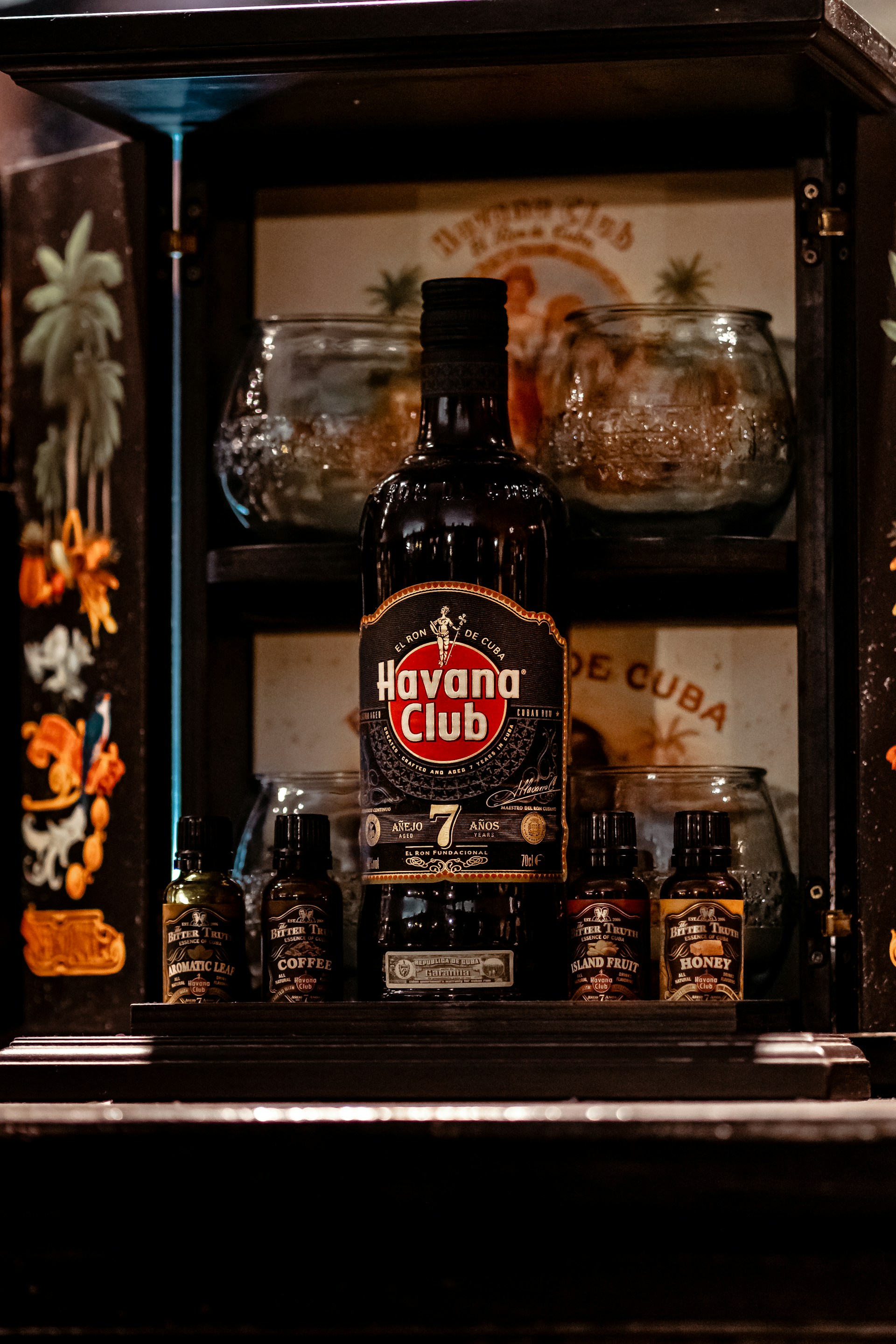 a bottle of alcohol sitting on top of a shelf