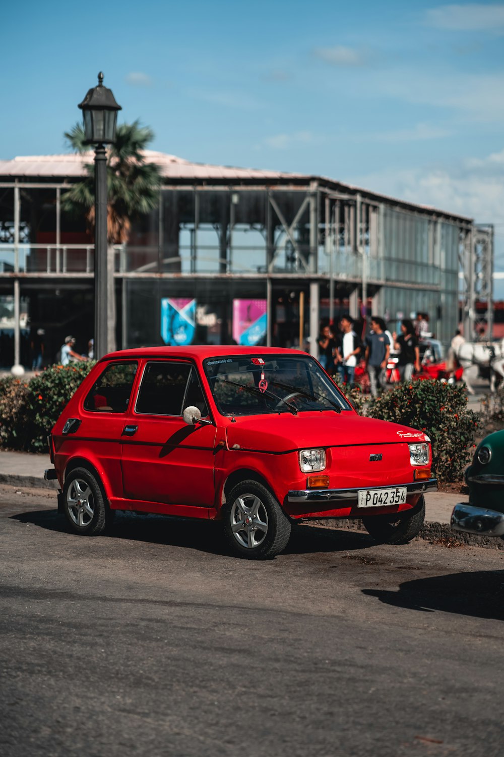 a red car parked on the side of the road