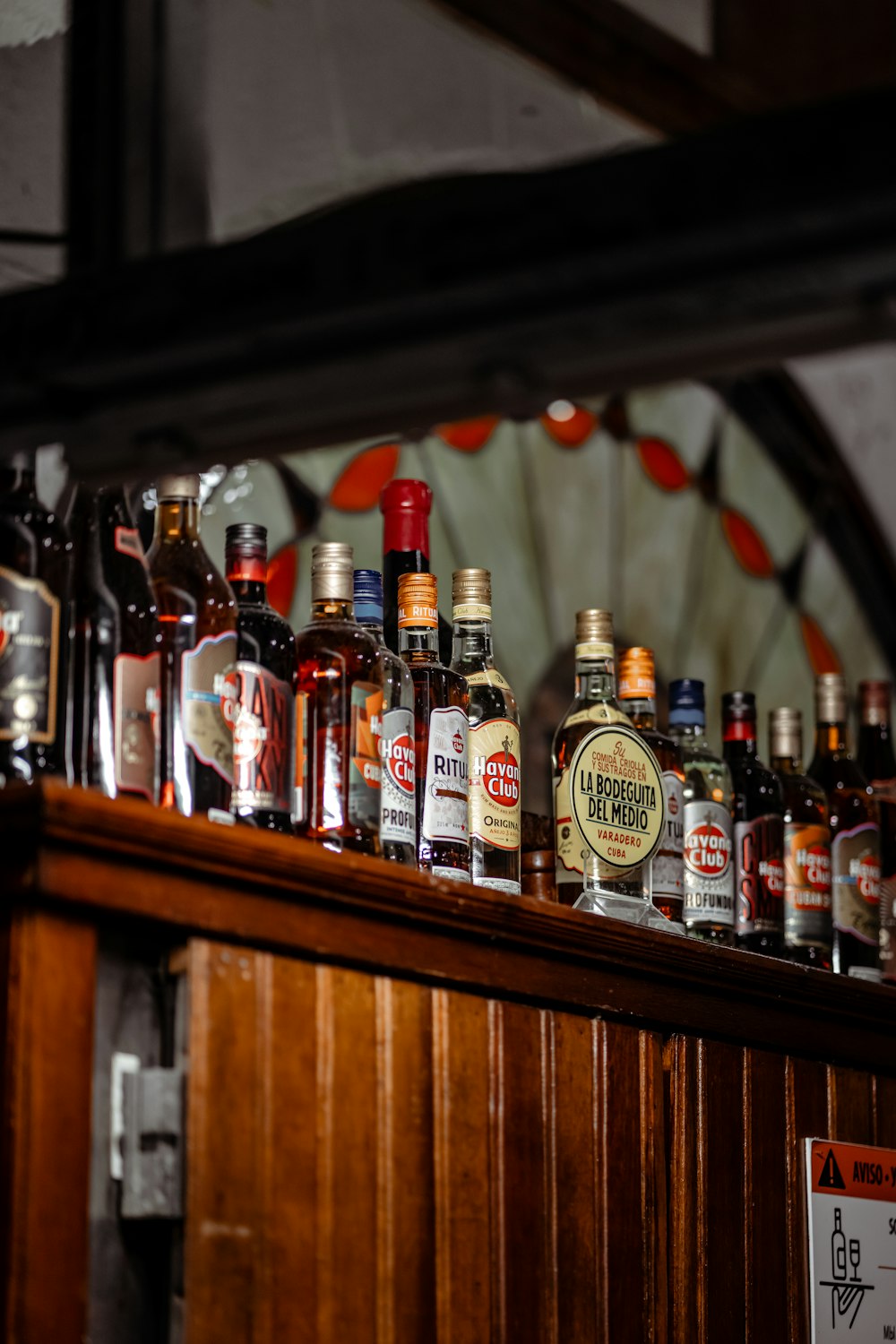 a bunch of bottles that are on a shelf