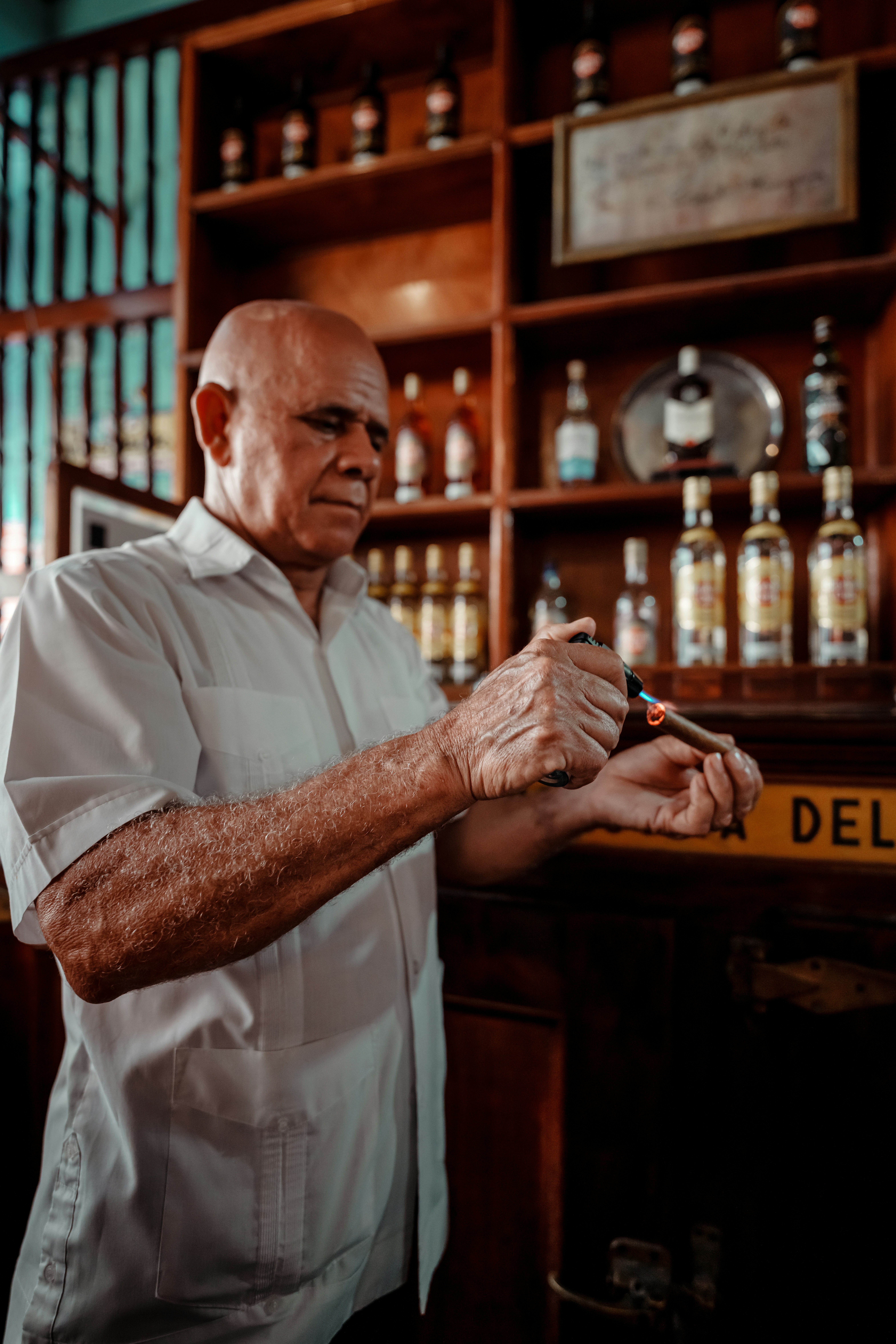 a man in a white shirt holding something in his hands