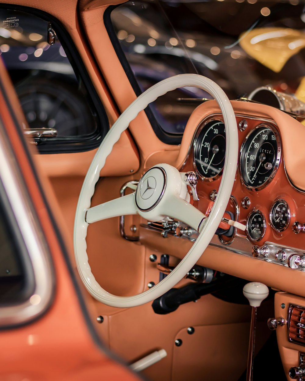 a car dashboard with a steering wheel and a dash board