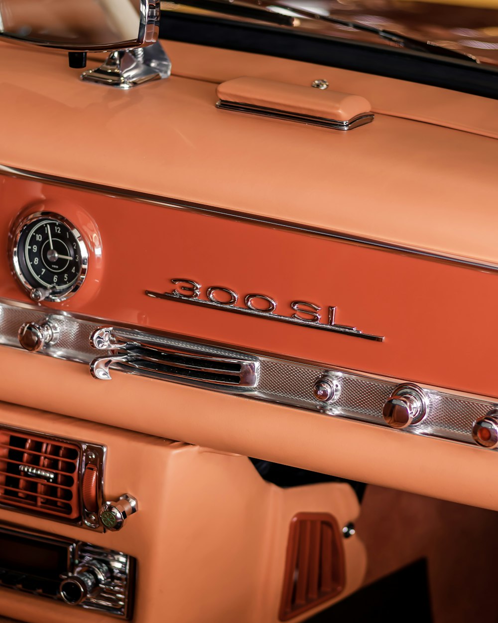 a close up of a car dashboard with a clock