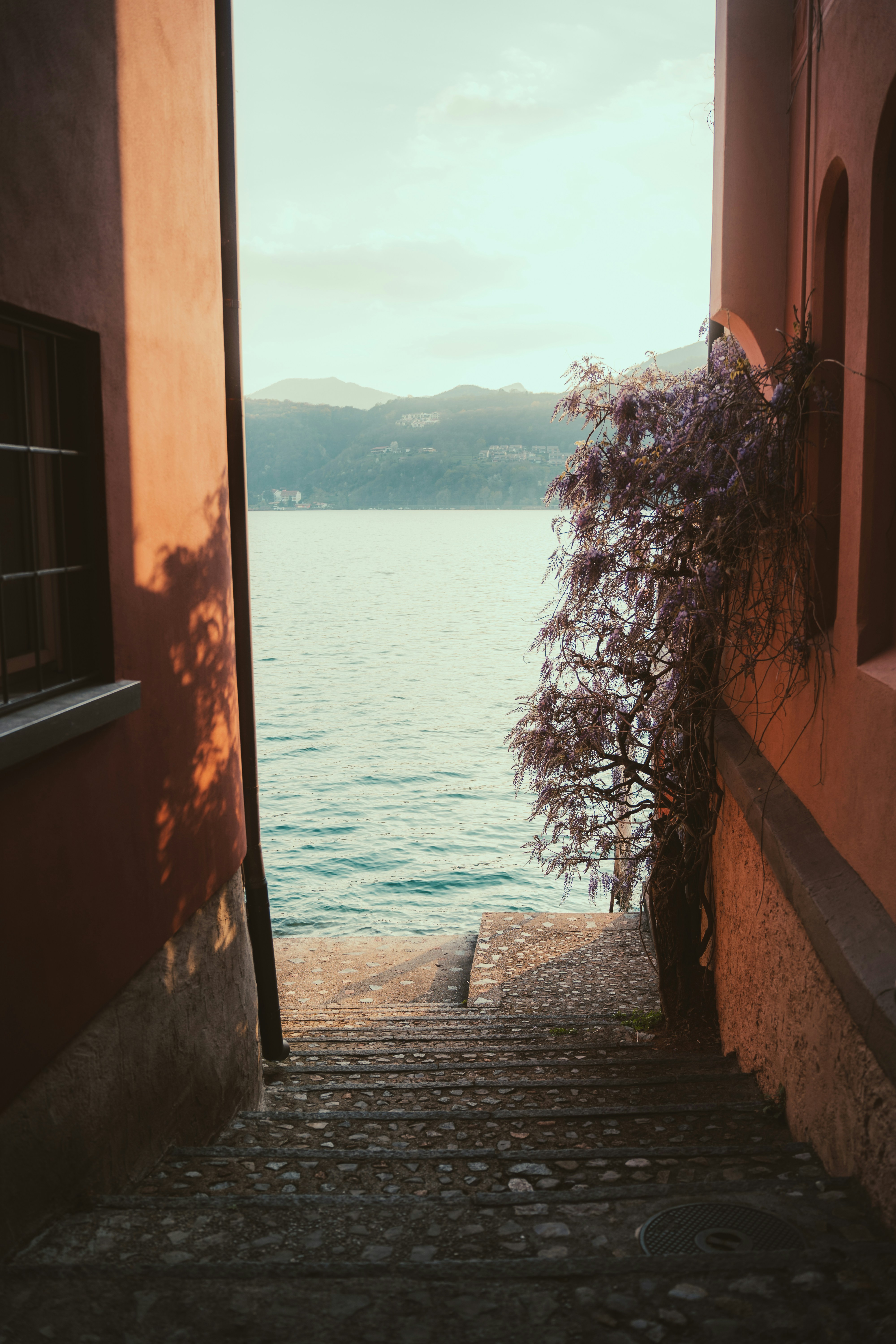 an open door leading to a body of water