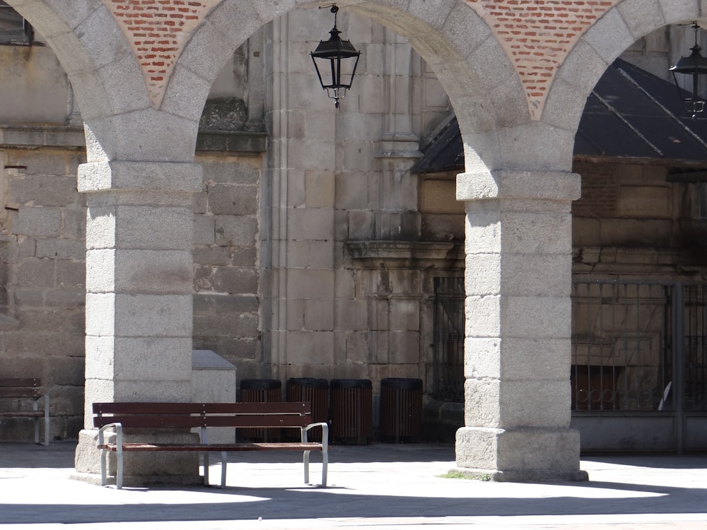 a couple of benches sitting in front of a building