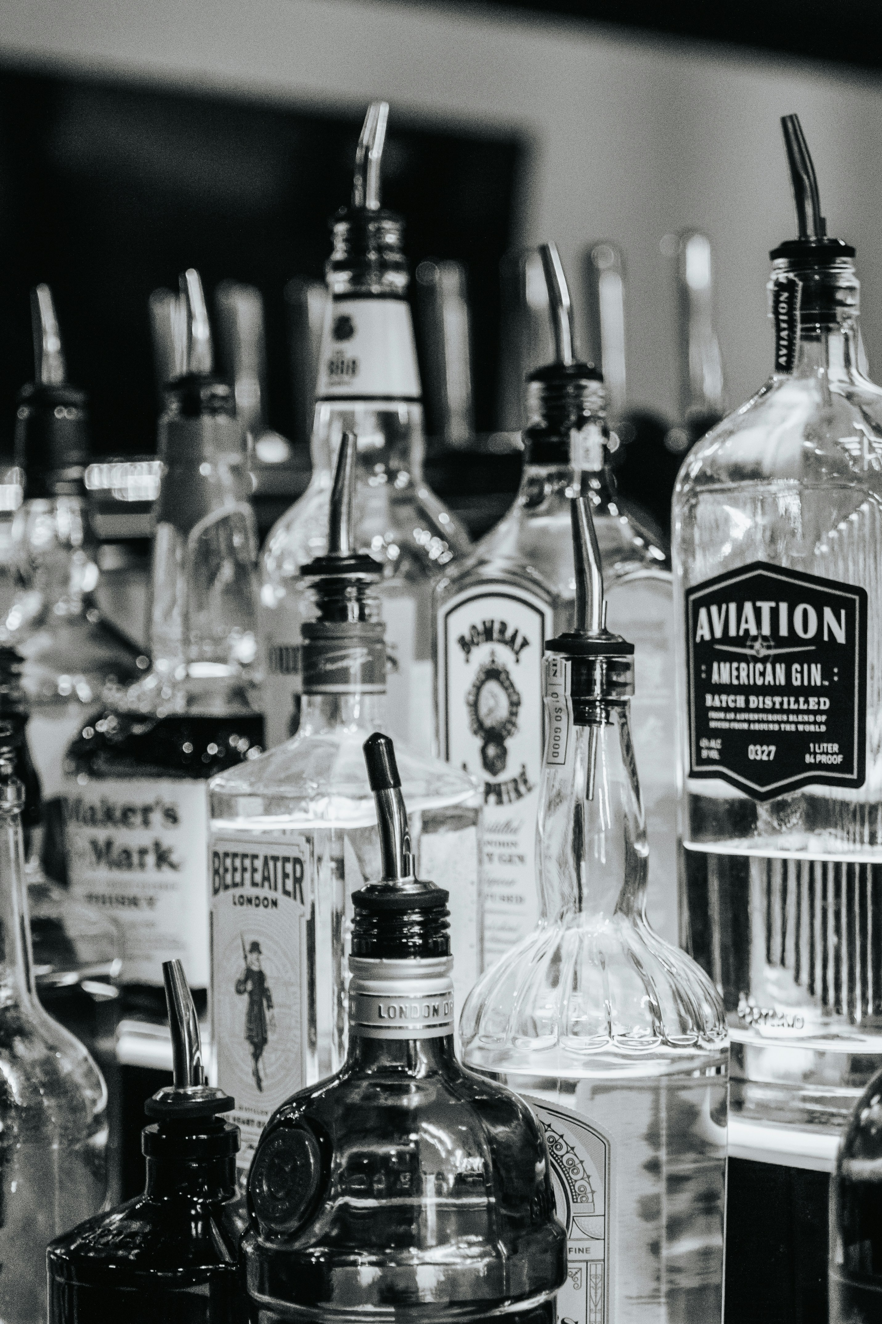a bunch of liquor bottles sitting on top of a counter