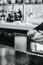 Close-up of a cocktail being prepared with fresh ingredients.