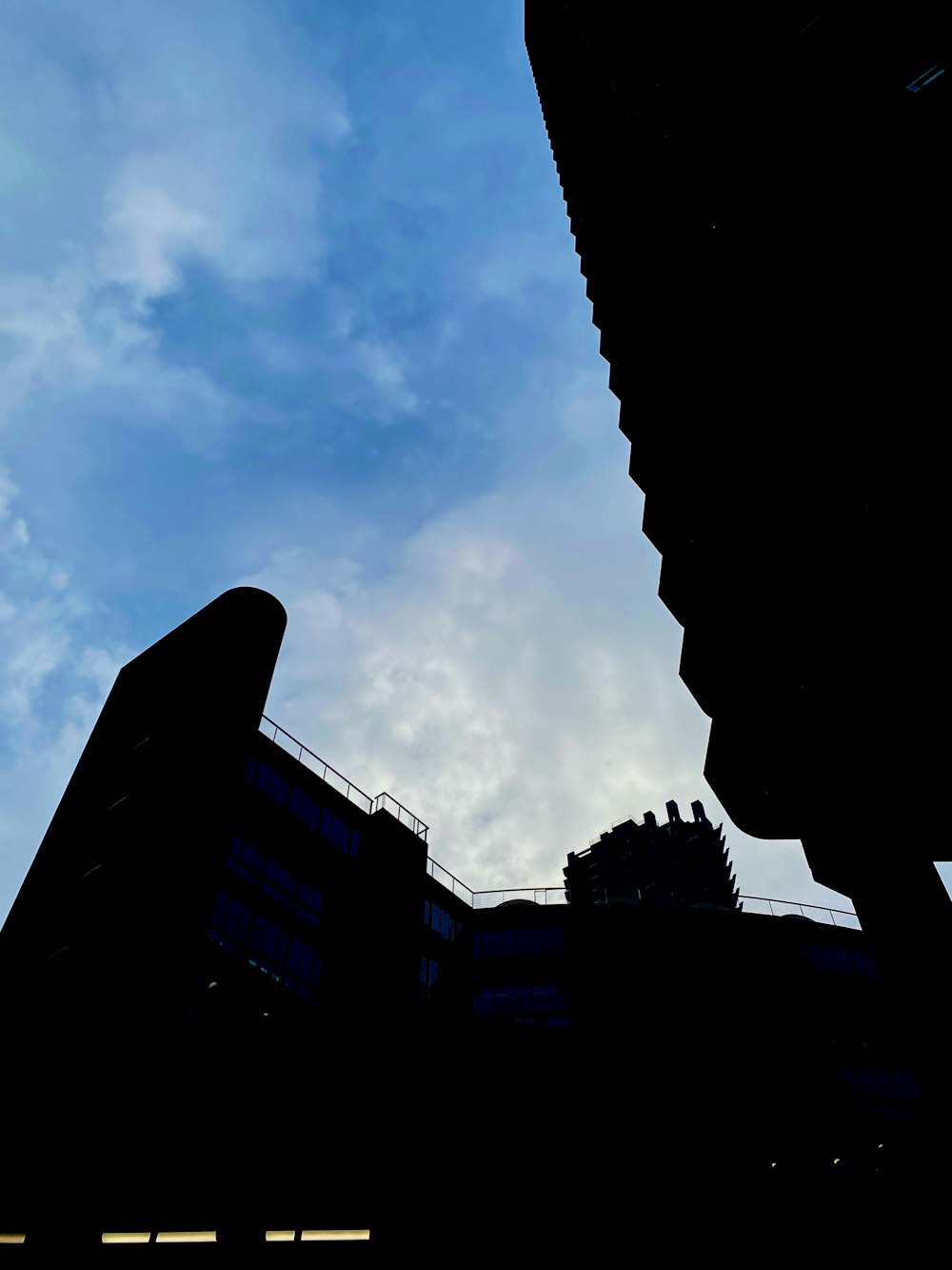 a tall building with a sky in the background