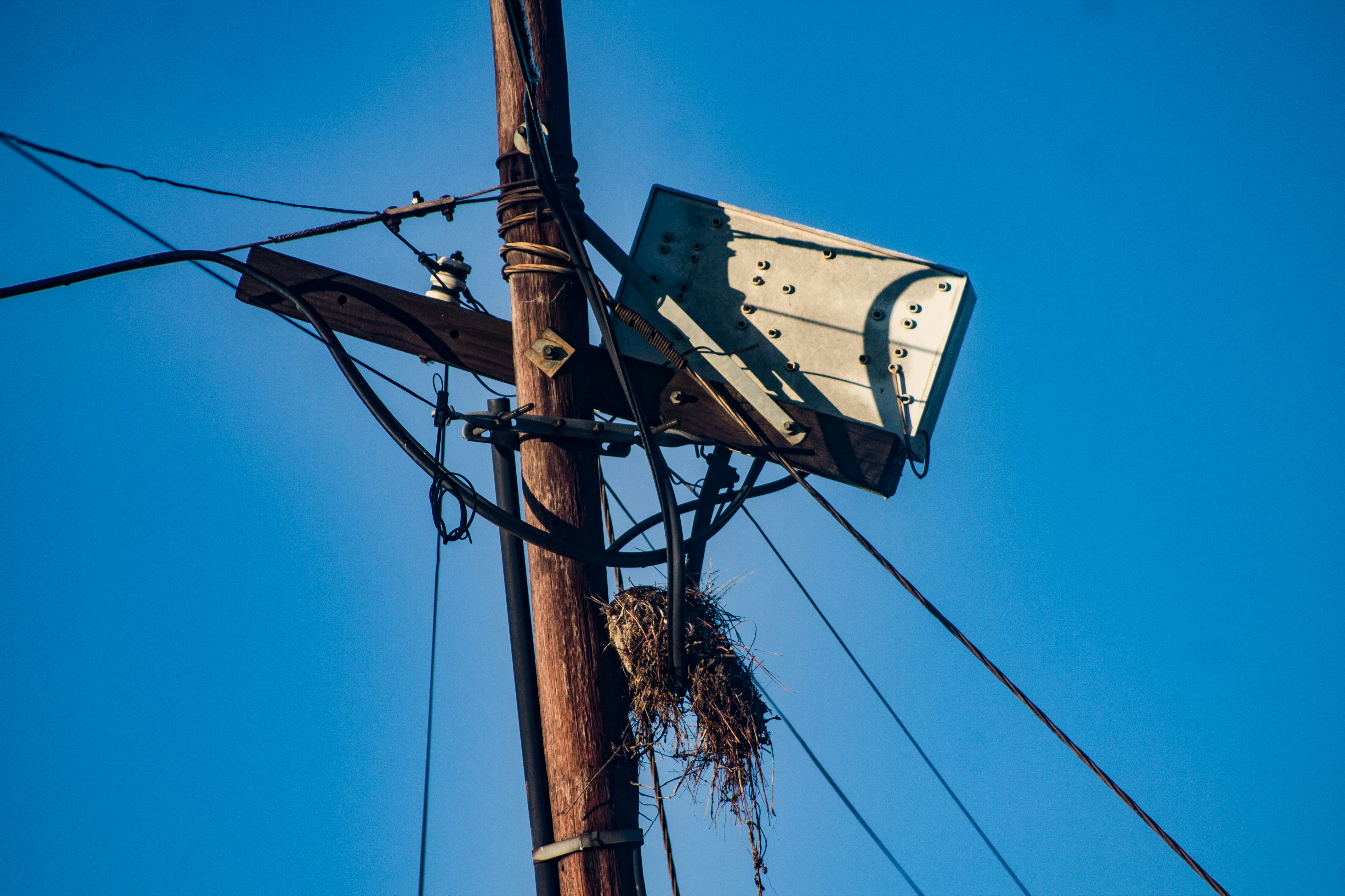 High-voltage transmission lines at sunset in South Africa, symbolising a grid under transition and strain
