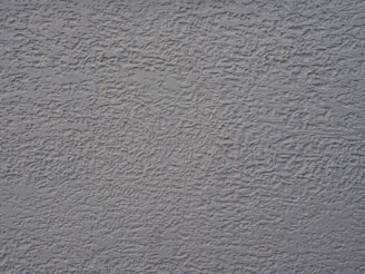 a close up of a wall with a gray color