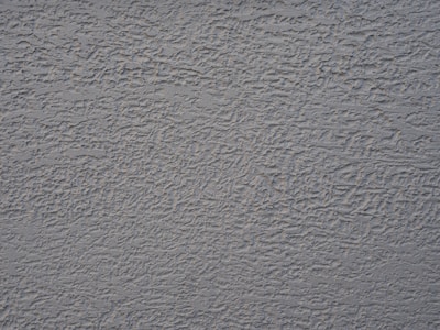 a close up of a wall with a gray color