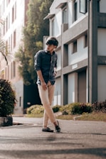 Stylish young man wearing casual modern clothing in an urban setting.