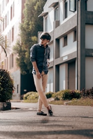 Stylish young man wearing casual modern clothing in an urban setting.