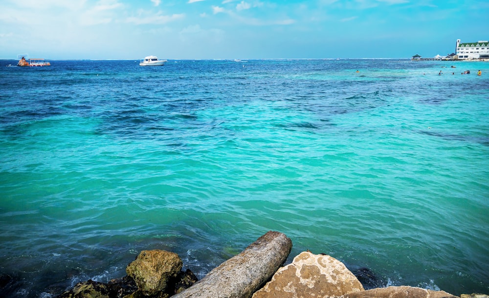 a body of water with boats in the distance