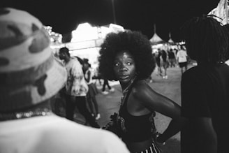 A dynamic photo of Natasha confidently speaking at a networking event, engaging with a diverse crowd.