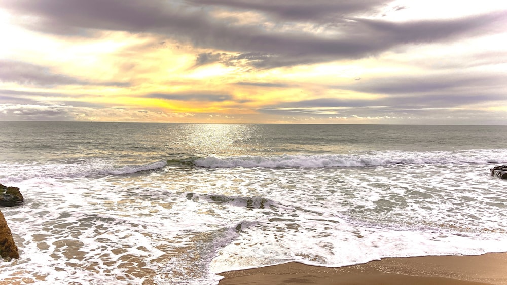 a view of the ocean from the shore of a beach