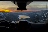 Thumbnail of a travel vlog showing a sunset over mountains.