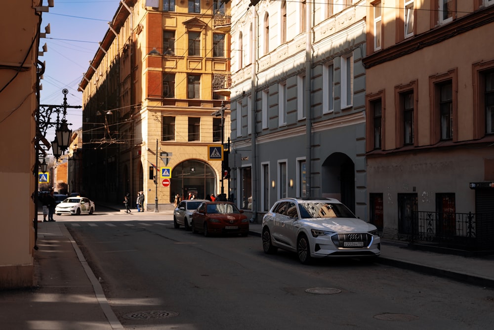 a couple of cars parked on the side of a road