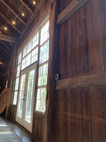 Interior view of a spacious living room with natural light pouring in, featuring Wallnut Builders' attention to detail.