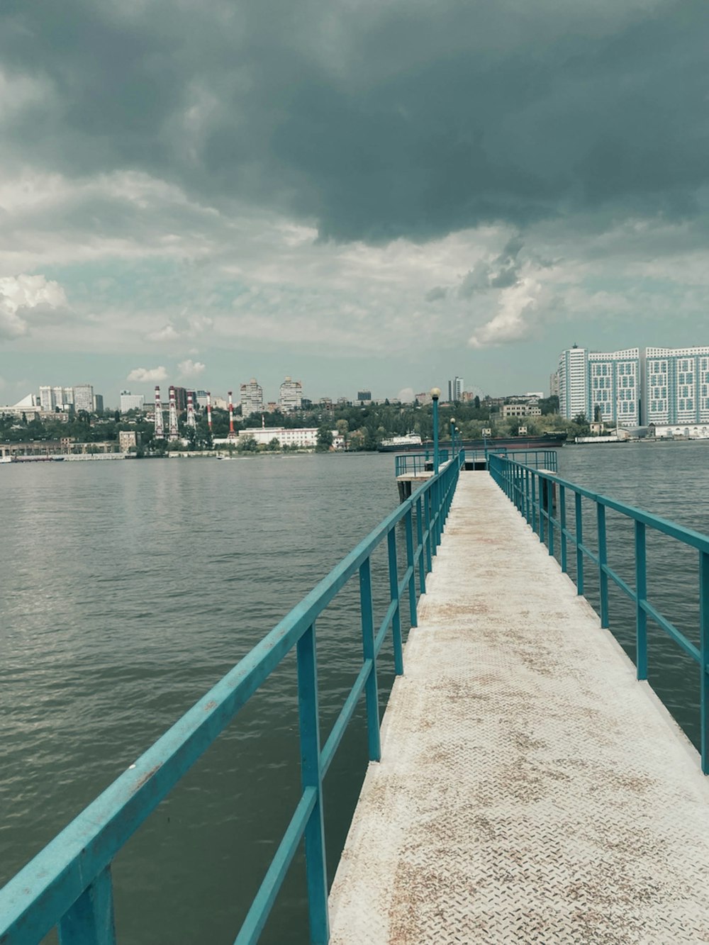 a long pier with a building in the background