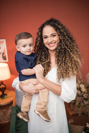 a woman holding a child in her arms