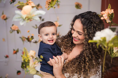 a woman holding a small child in her arms