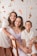 a woman and two children posing for a picture