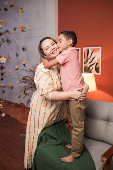 a woman holding a small child in her arms