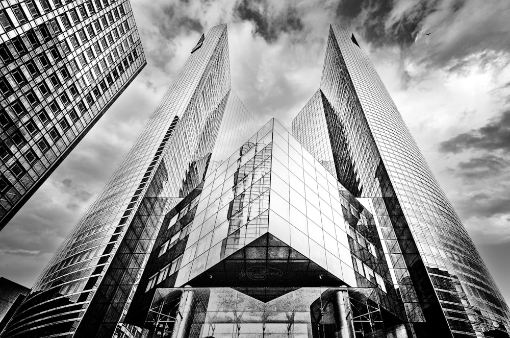 a black and white photo of some very tall buildings