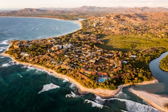 an aerial view of a tropical island with a beach
