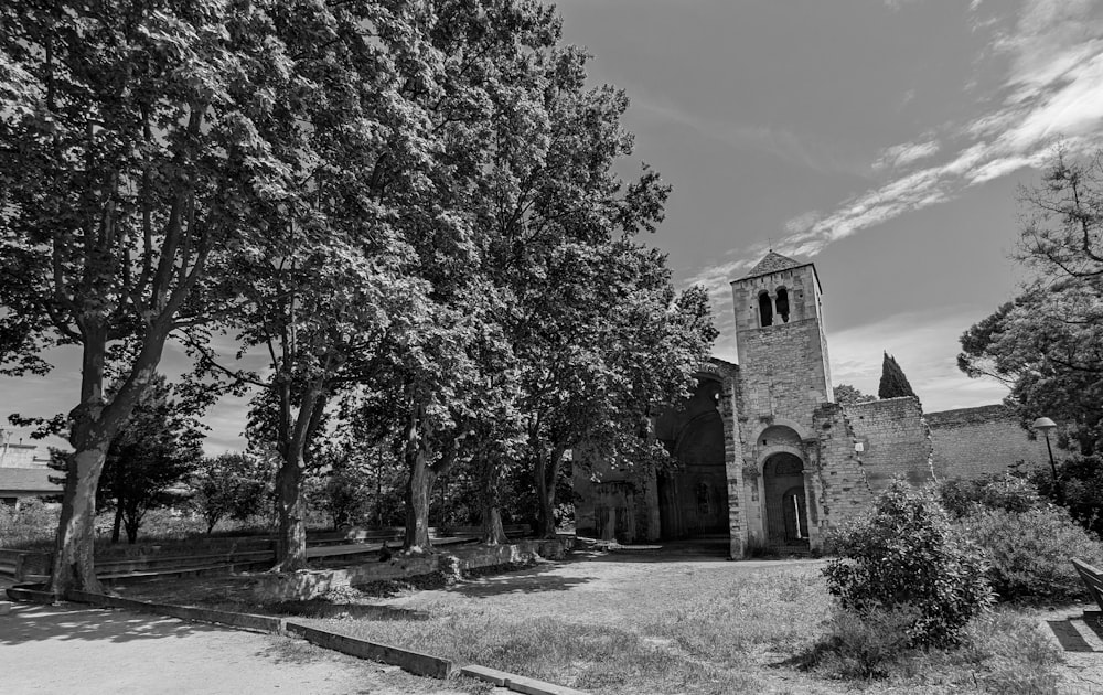 a black and white photo of an old church