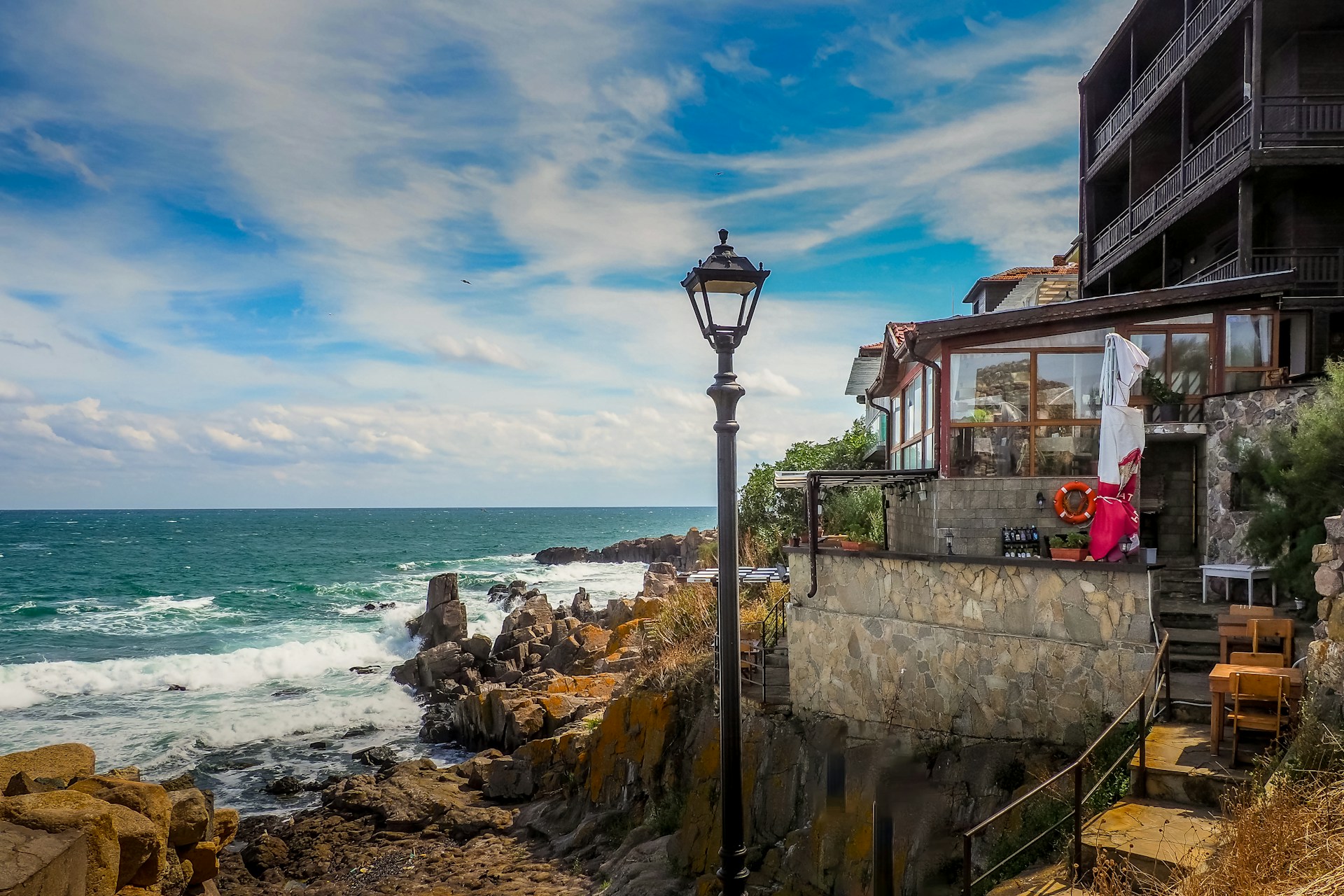 black and brown leather padded tub sofa