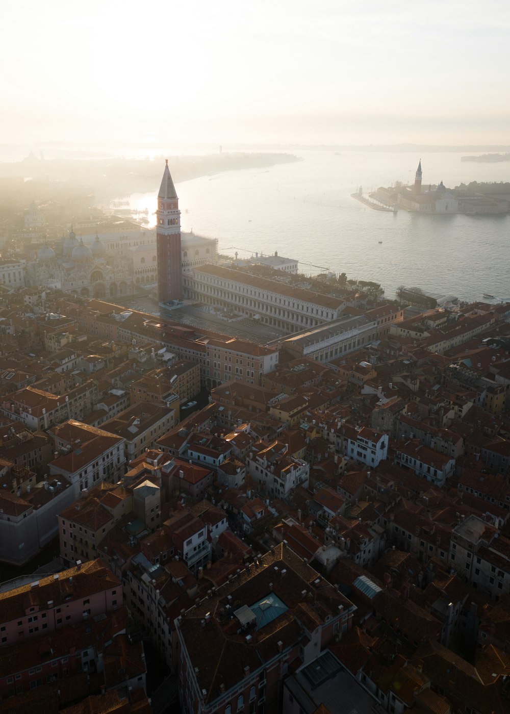 an aerial view of a city with a clock tower