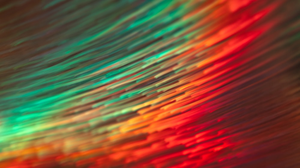 a blurry image of a rainbow colored background