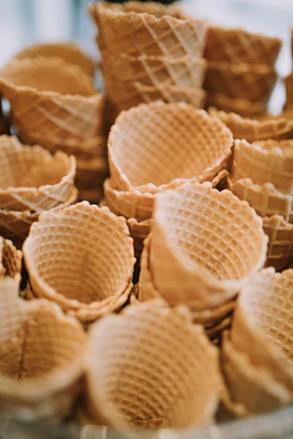 a bowl filled with waffles sitting on top of a table