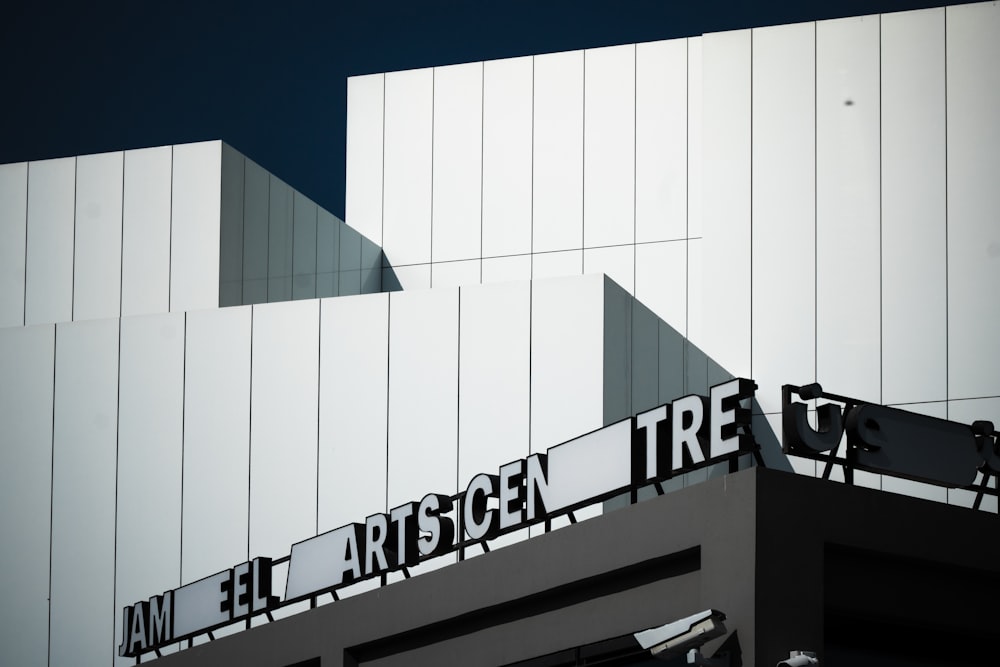 a tall building with a sign on top of it