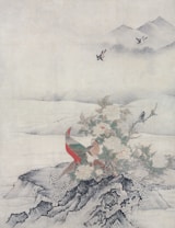 A traditional painting depicts a scene with a colorful pheasant standing on rocky terrain surrounded by blooming flowers and foliage. In the background, gentle hills fade into mist, while birds fly gracefully in the serene sky above.
