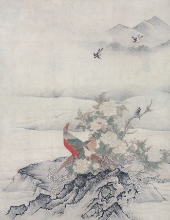 A traditional painting depicts a scene with a colorful pheasant standing on rocky terrain surrounded by blooming flowers and foliage. In the background, gentle hills fade into mist, while birds fly gracefully in the serene sky above.