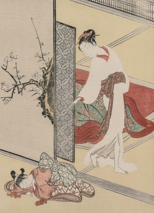 A traditional Japanese scene featuring a woman in an elegant kimono, standing beside a decorative folding screen. She is holding part of her kimono and extending a hand, possibly to open the screen. Nearby, a sleeping child is curled up on the floor, also dressed in a patterned garment. The setting includes a blossoming branch in the background, and the interior features muted tones and geometric patterns.