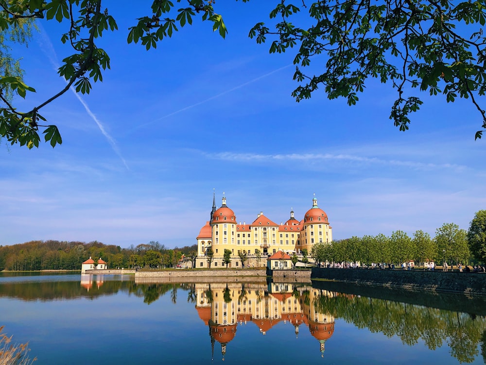 a large building sitting on top of a lake