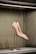 A pair of elegant shoes displayed on a soft fabric background.