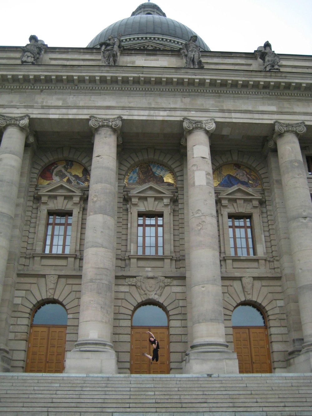 a large building with columns and a dome on top of it