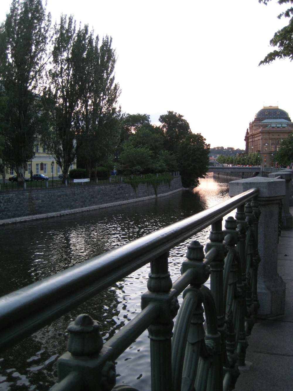 a river running through a city next to a bridge