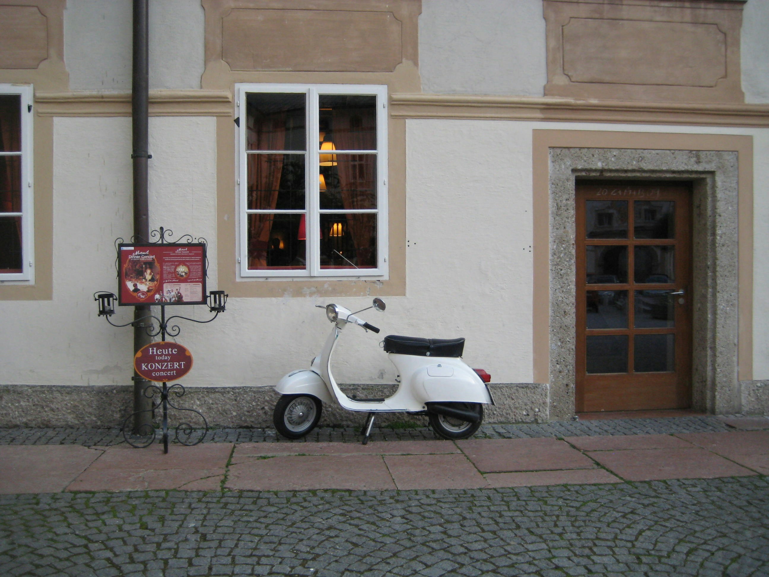 a scooter is parked in front of a building