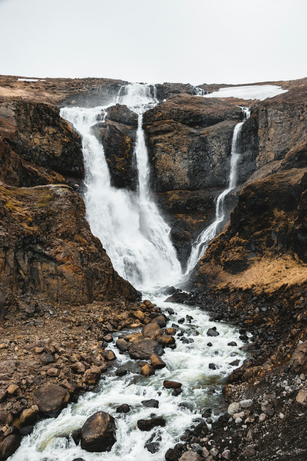 a large waterfall with a bunch of water coming out of it