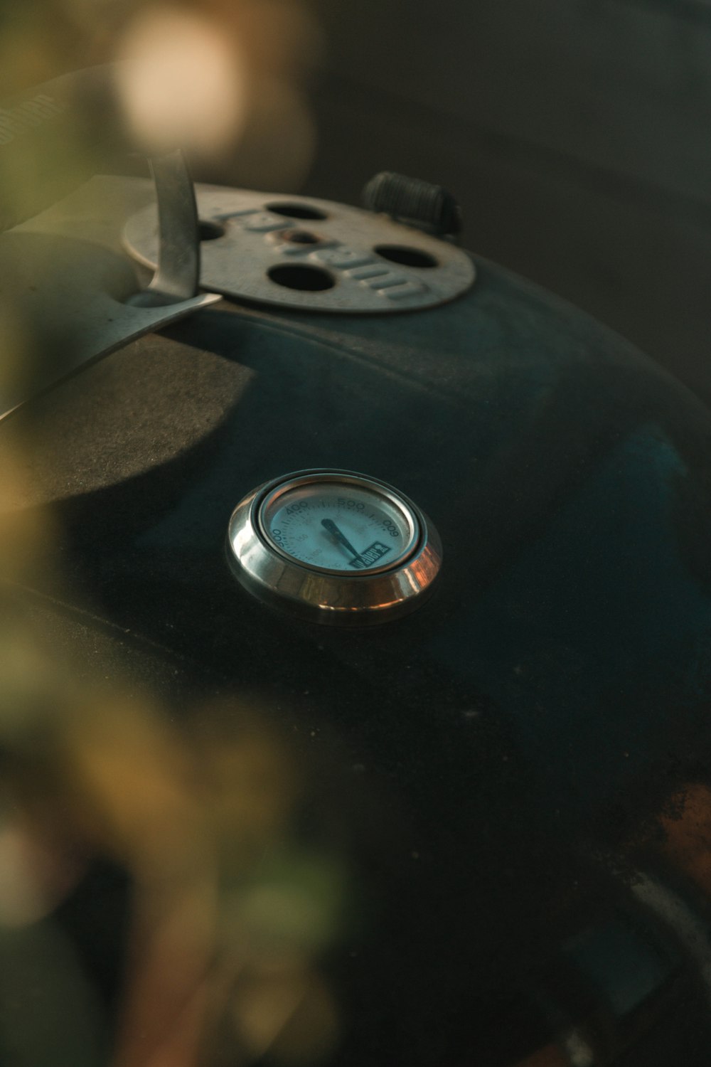 a close up of a clock on a black object