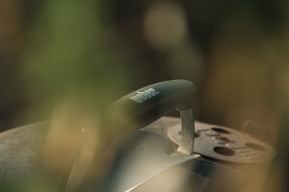 a close up of a remote control with a blurry background