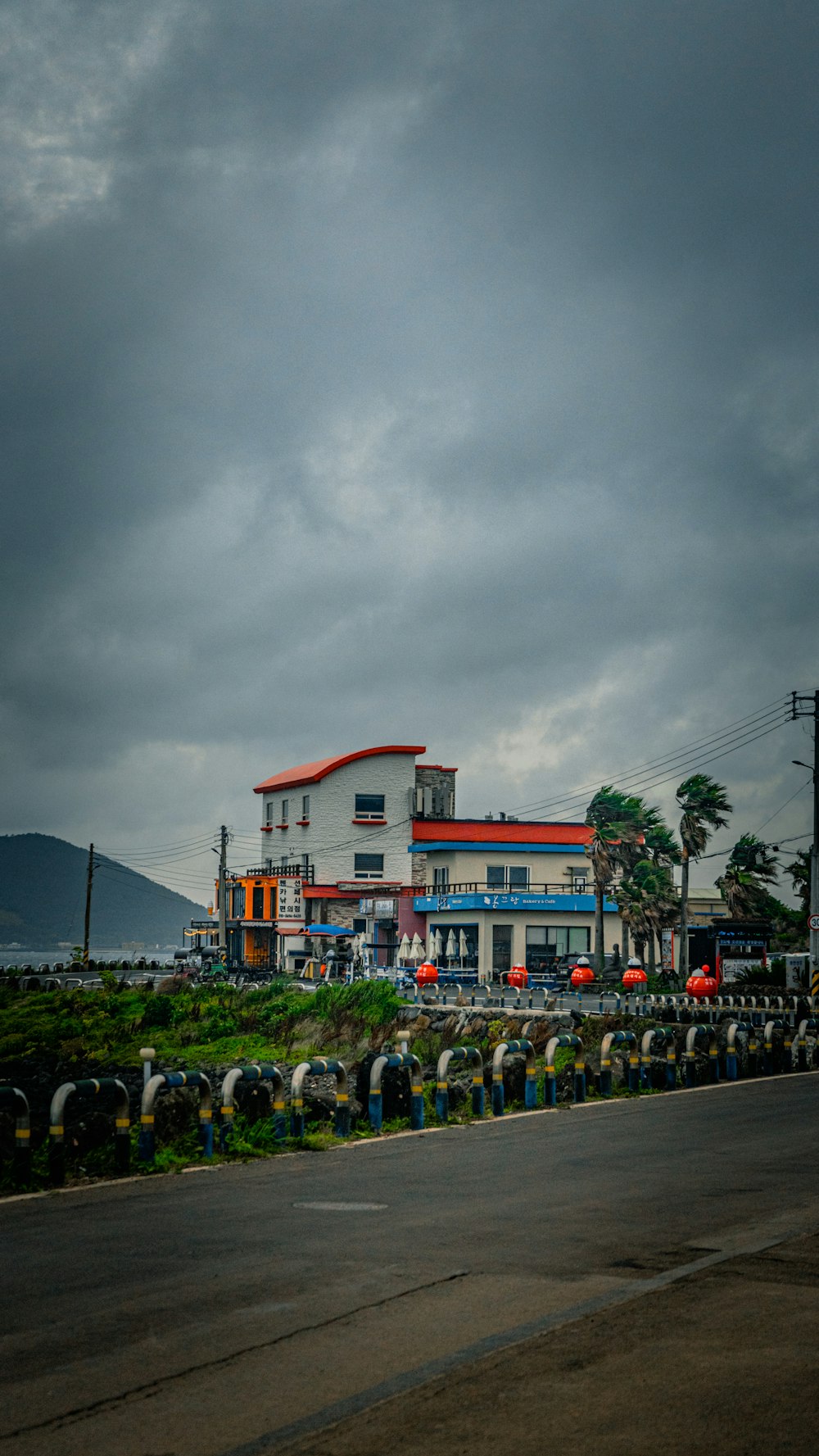 a large white building sitting on the side of a road