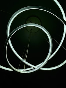 Delicate artificial rings arranged in a soft, glowing setting.