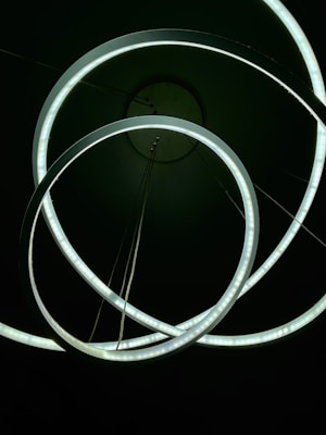 Delicate artificial rings arranged in a soft, glowing setting.