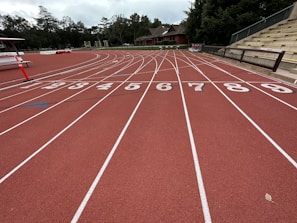 a red running track with numbers on it